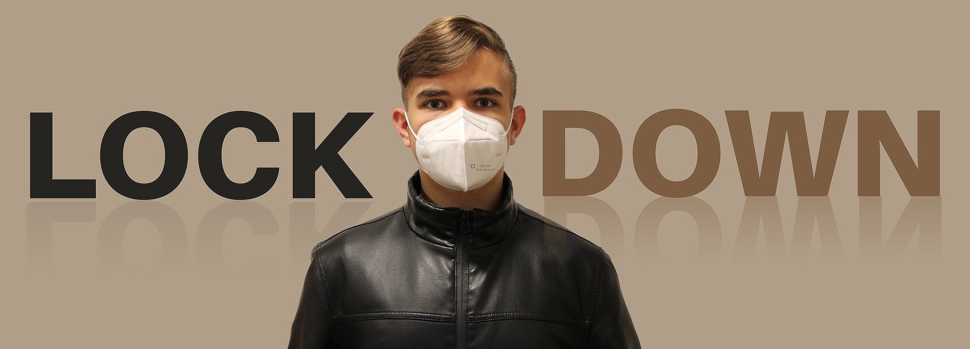 Image of boy wearing mask in front of text saying "Lock Down"